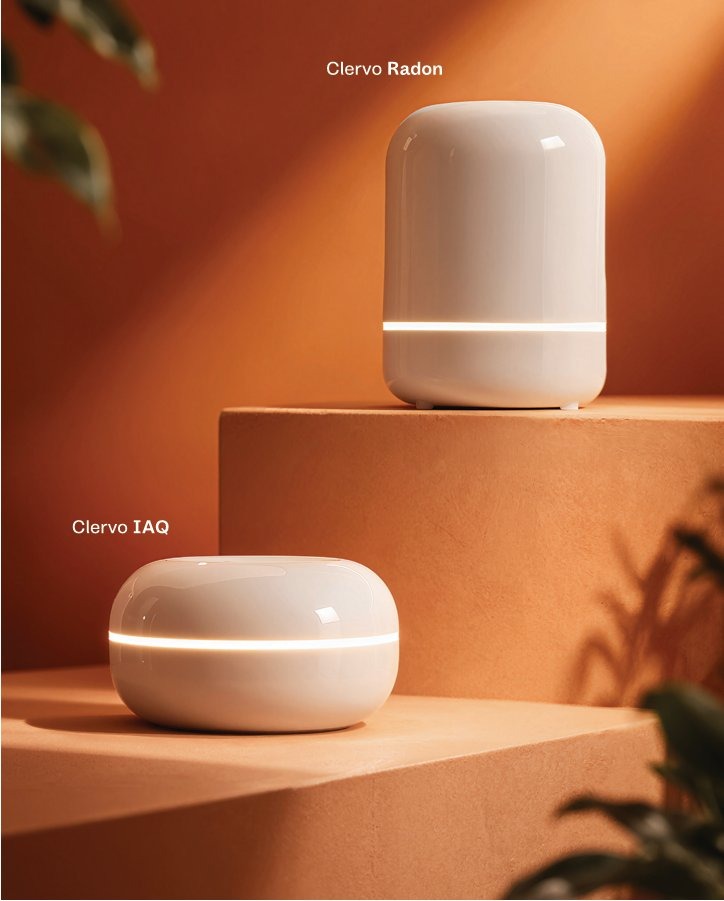 Clervo Radon and Clervo IAQ on warm terracotta pedestals with soft natural light