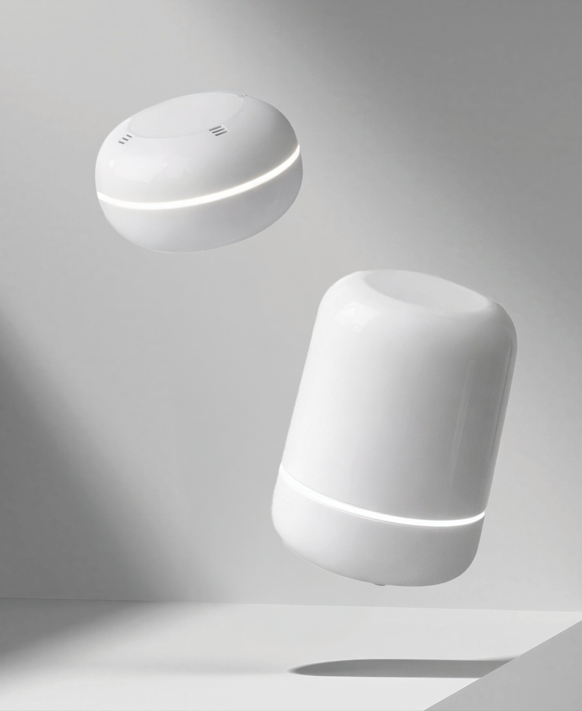 Clervo Radon and Clervo IAQ floating against a soft gray studio backdrop with cinematic light
